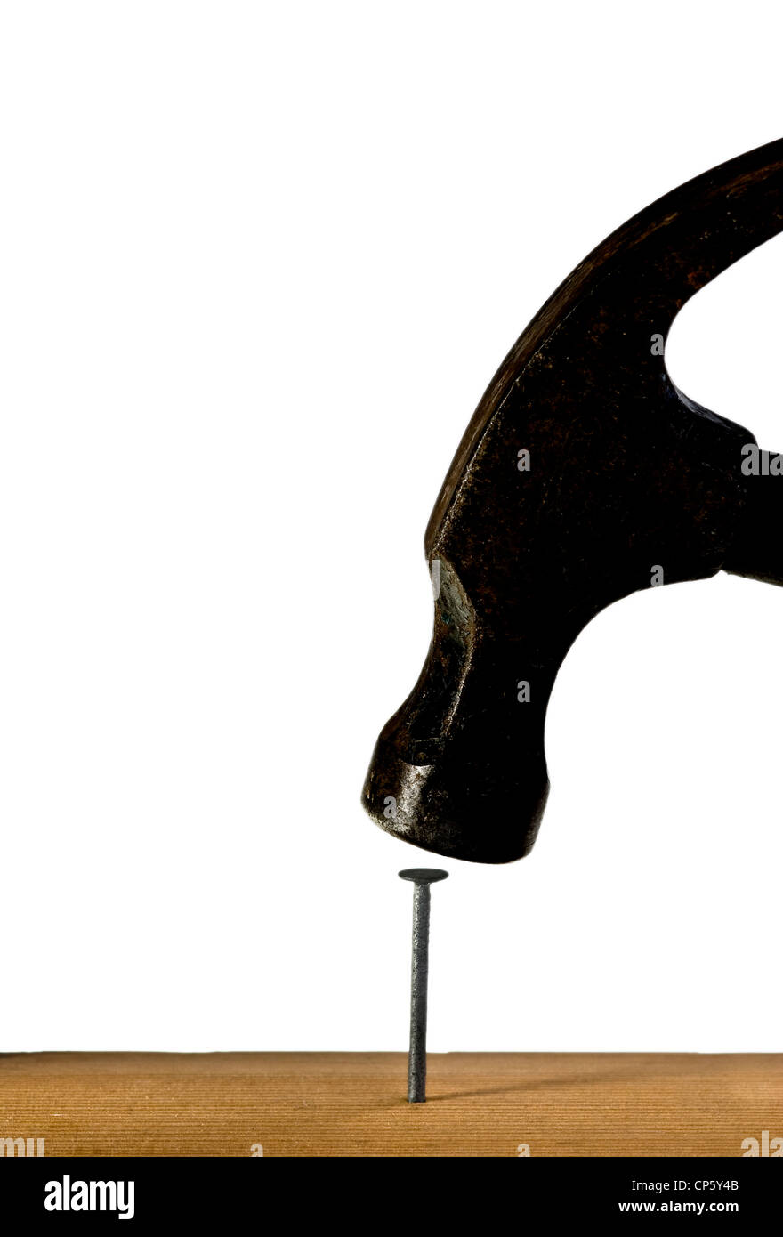 Hammer hitting a nail into some wood Stock Photo Alamy