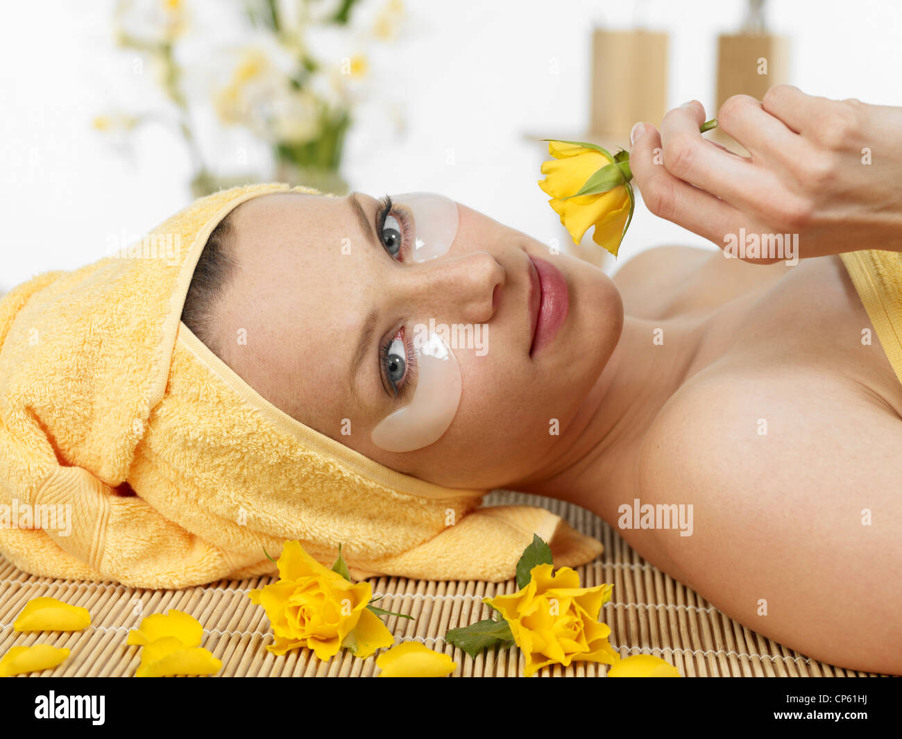 Young woman at spa with flower Stock Photo