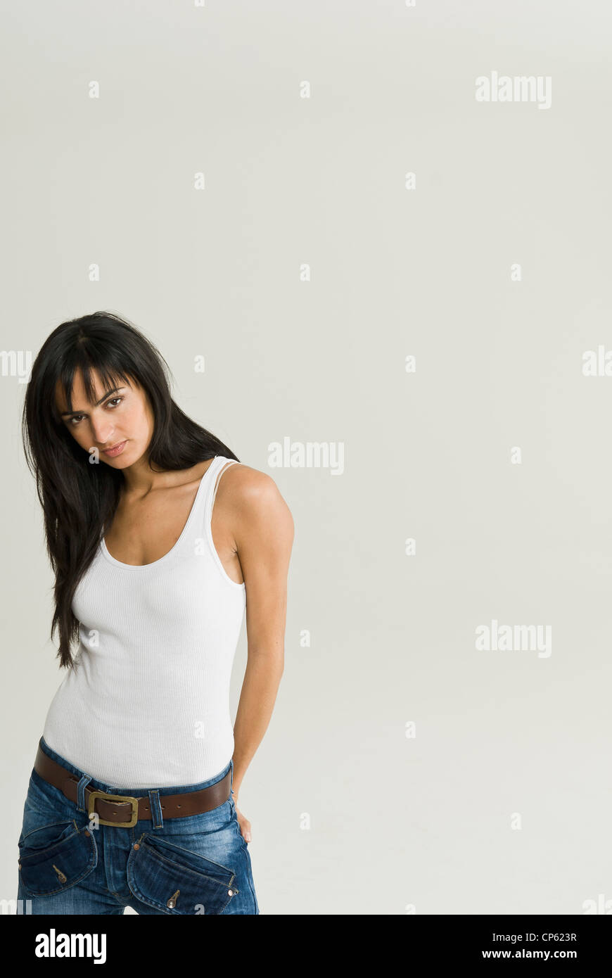 Young woman with hands behind back, portrait Stock Photo - Alamy