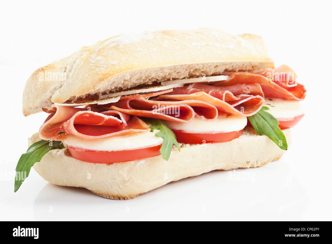 Panini with ham, tomatoes, mozarella, rocket and italian cheese Stock Photo