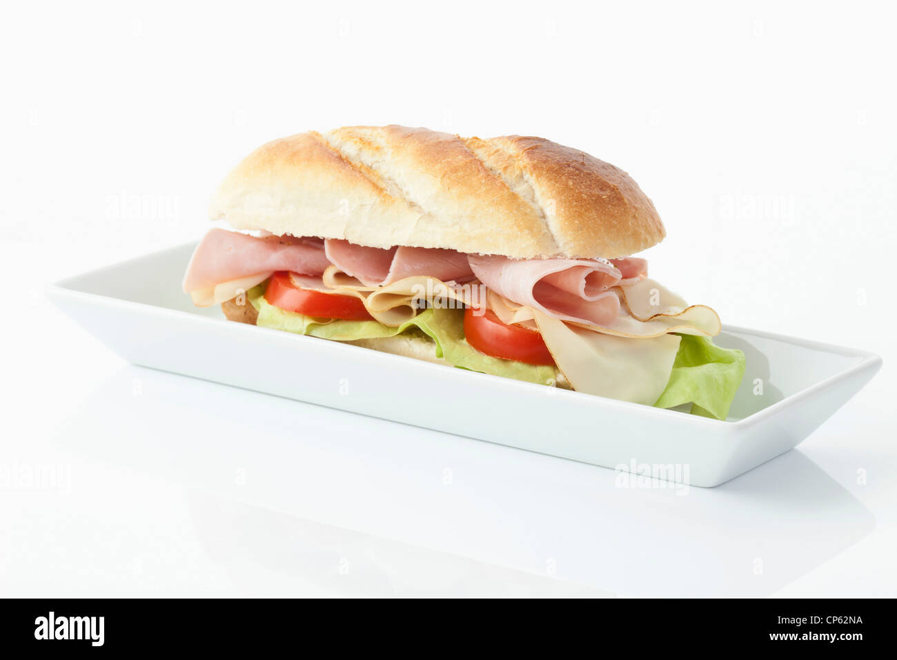 Baguette with ham, cheese, tomato and salad Stock Photo Alamy