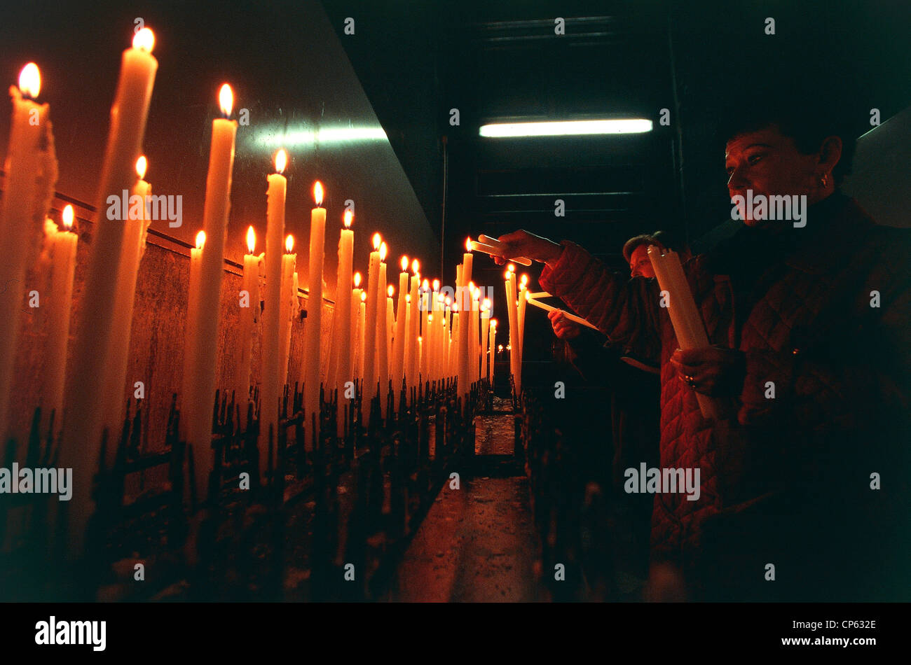 Emilia Romagna Bologna, Colle della Guardia. Sanctuary of Madonna di San Luca. Celebration of Feast of St. Luke. Candles. Stock Photo
