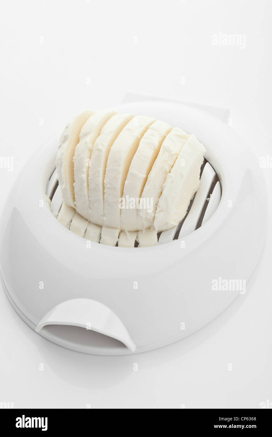 Mozzarella cheese on egg cutter Stock Photo Alamy