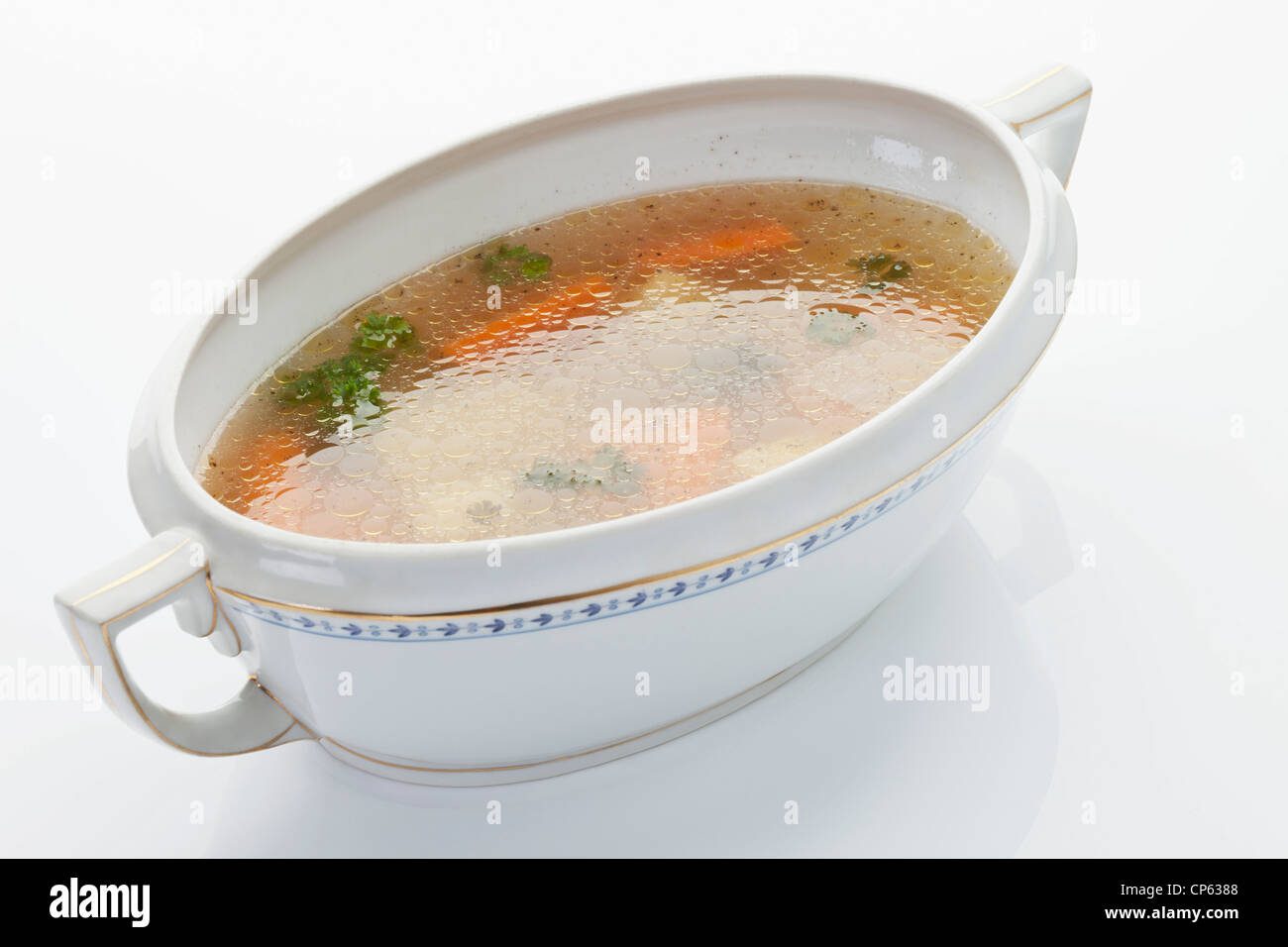 Chicken soup in tureen on white background Stock Photo Alamy