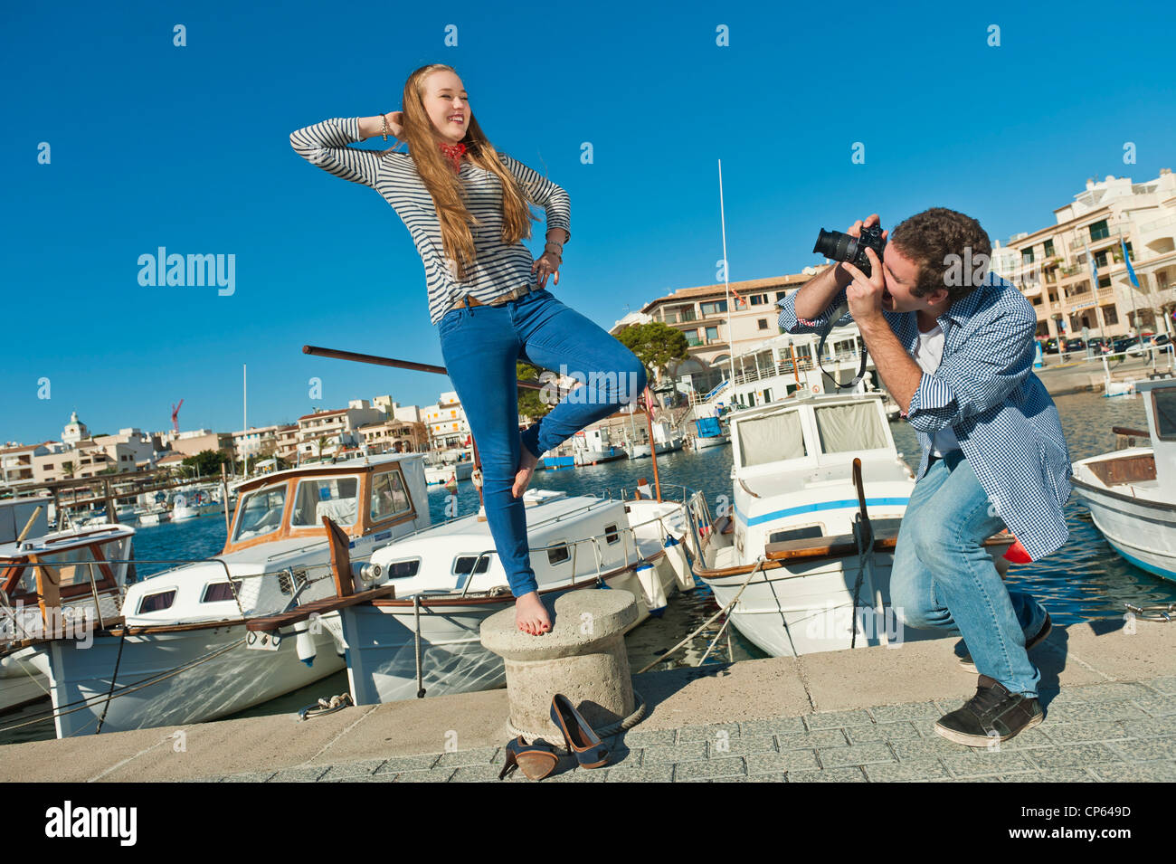 Spain, Mallorca, Couple taking pictures at harbour Stock Photo