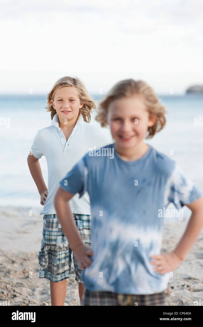 Spain, Mallorca, Children on beach, smiling, portrait Stock Photo