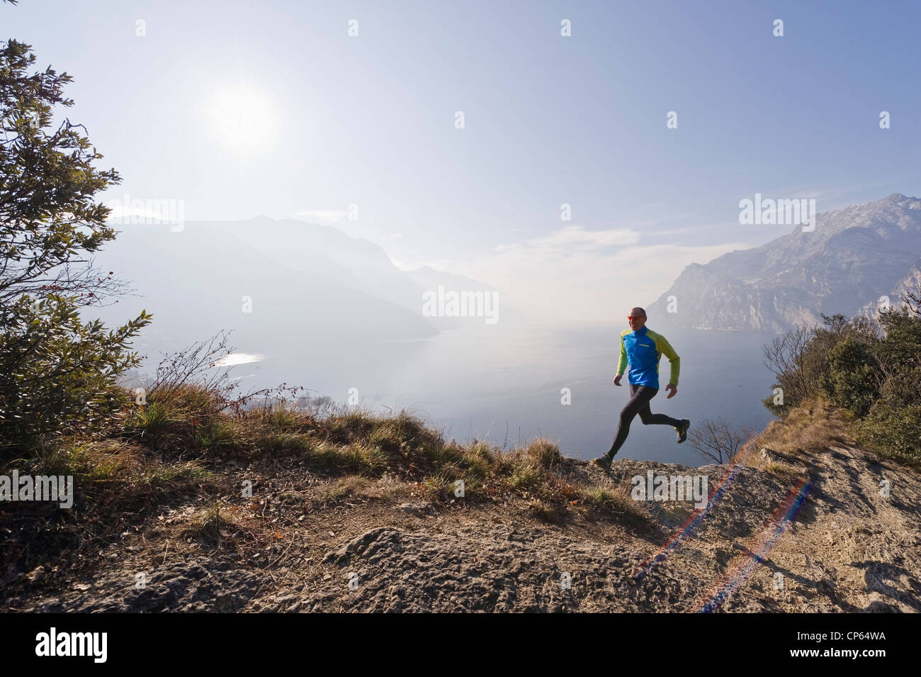 Man running at lake garda hi-res stock photography and images - Alamy