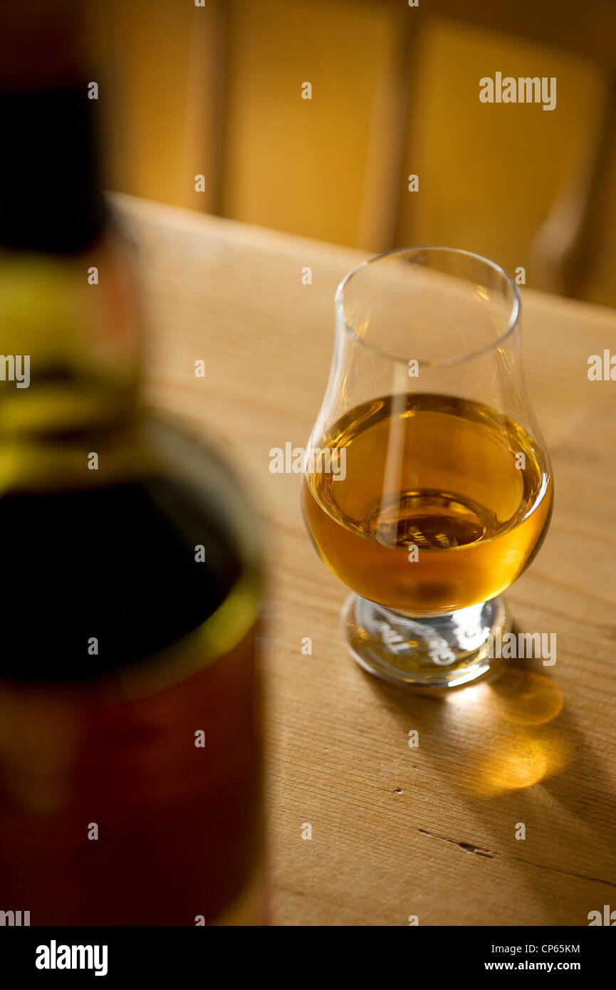 glass of whisky on pub table Stock Photo