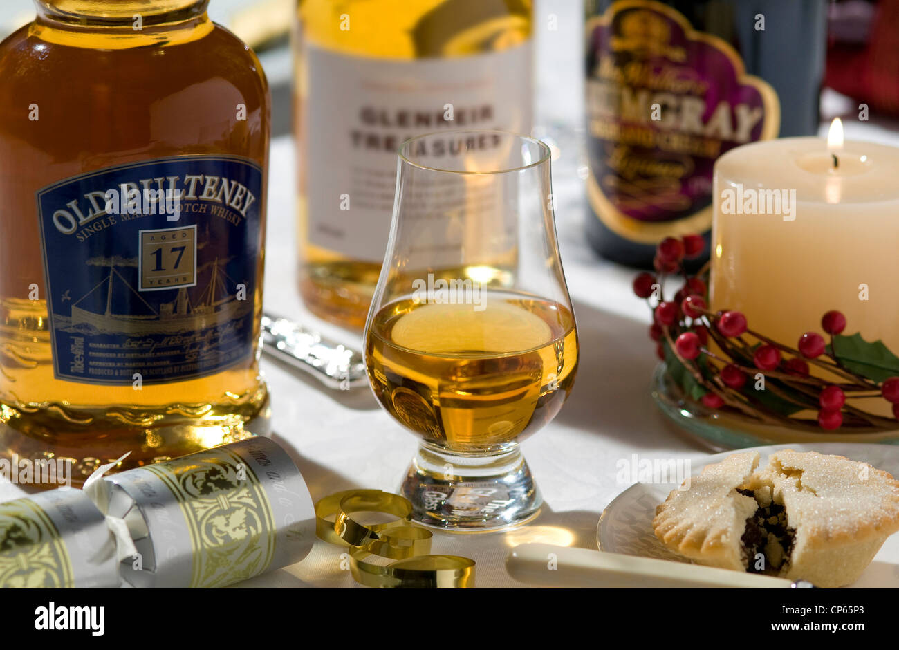 bottles of whisky at christmas on white table top Stock Photo