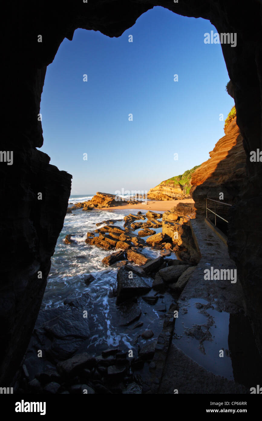 Hole in the rock cliff at Thompson's Bay, Ballito, Kwazulu Natal, South Africa Stock Photo