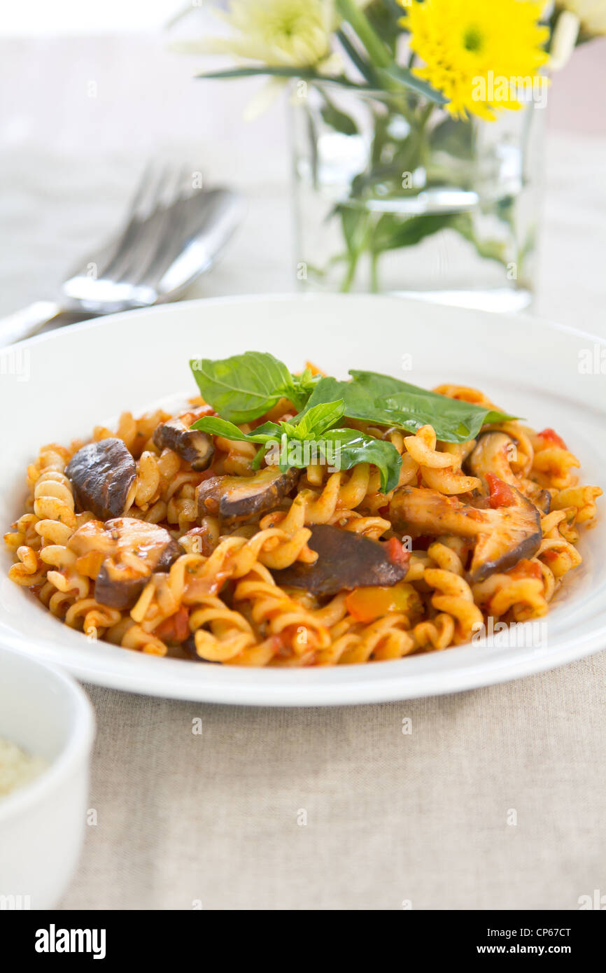 Pasta with mushroom in tomato sauce Stock Photo