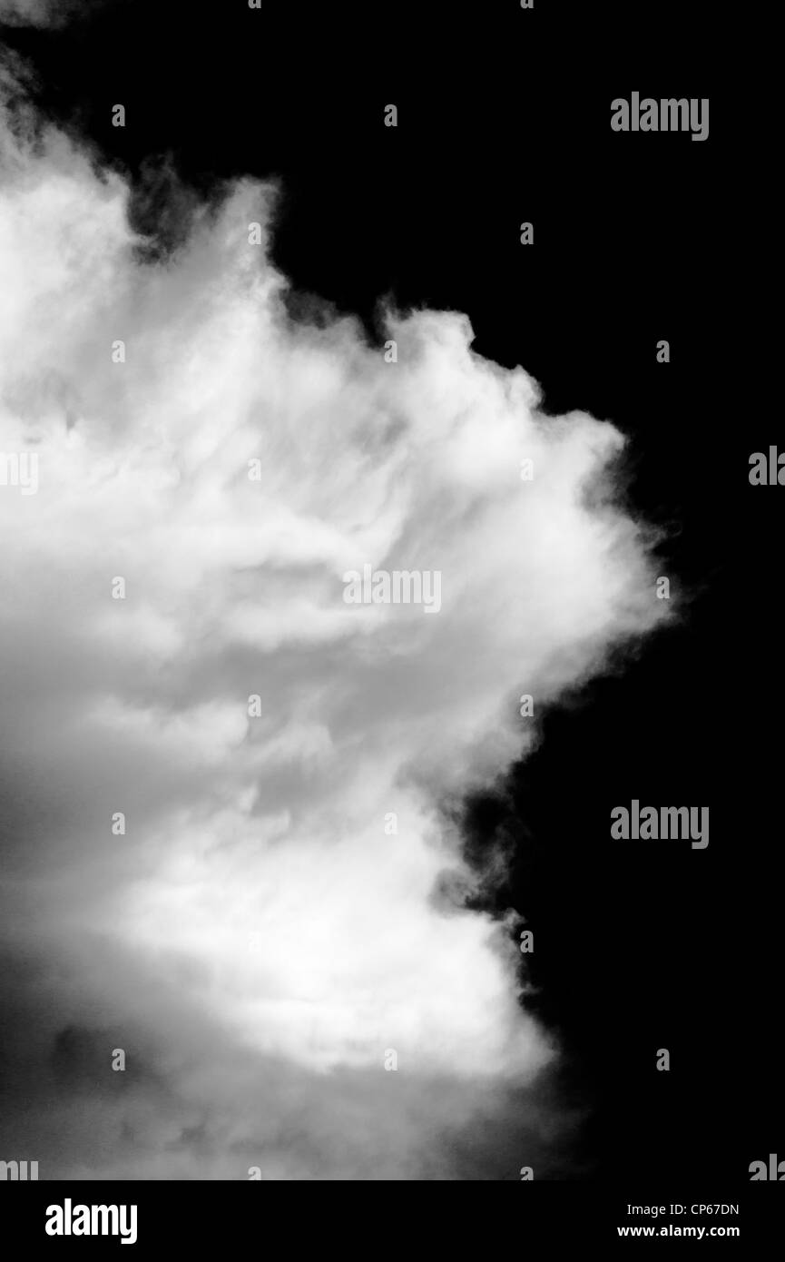 Black and white photograph of puffy white clouds against a clear ...