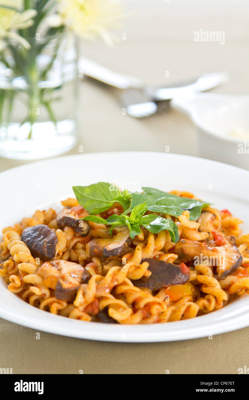 Pasta with mushroom in tomato sauce Stock Photo