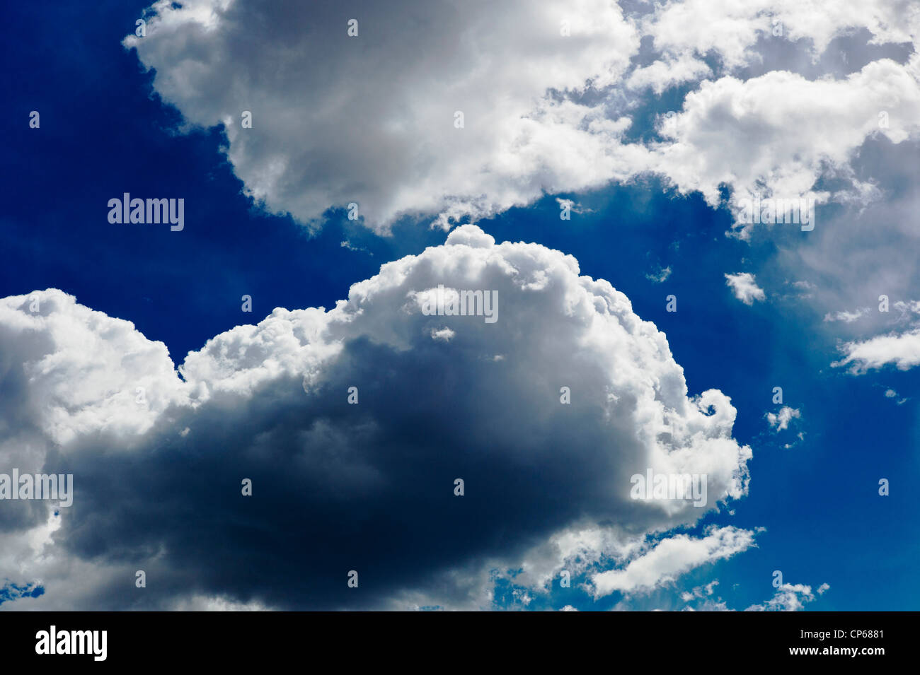 Puffy white clouds against a cobalt blue Colorado sky Stock Photo Alamy