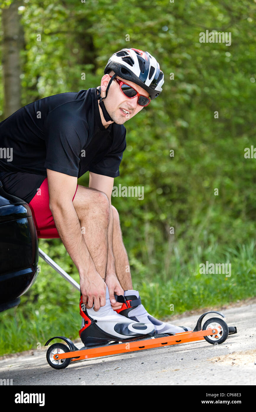 A young man crosscountry skiing with roller ski Stock Photo Alamy