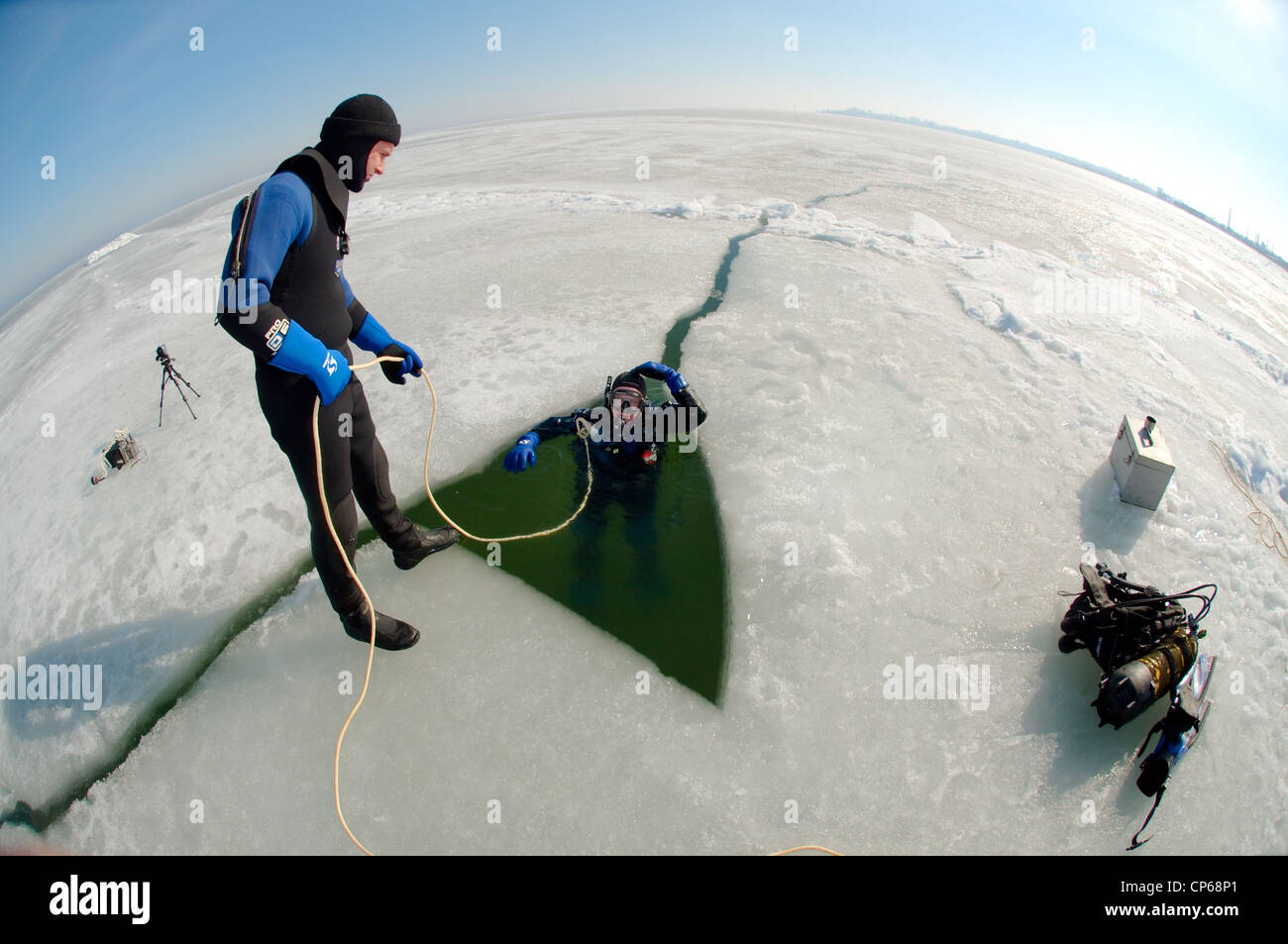 Divers, subglacial diving, ice diving, in the frozen Black Sea, a rare