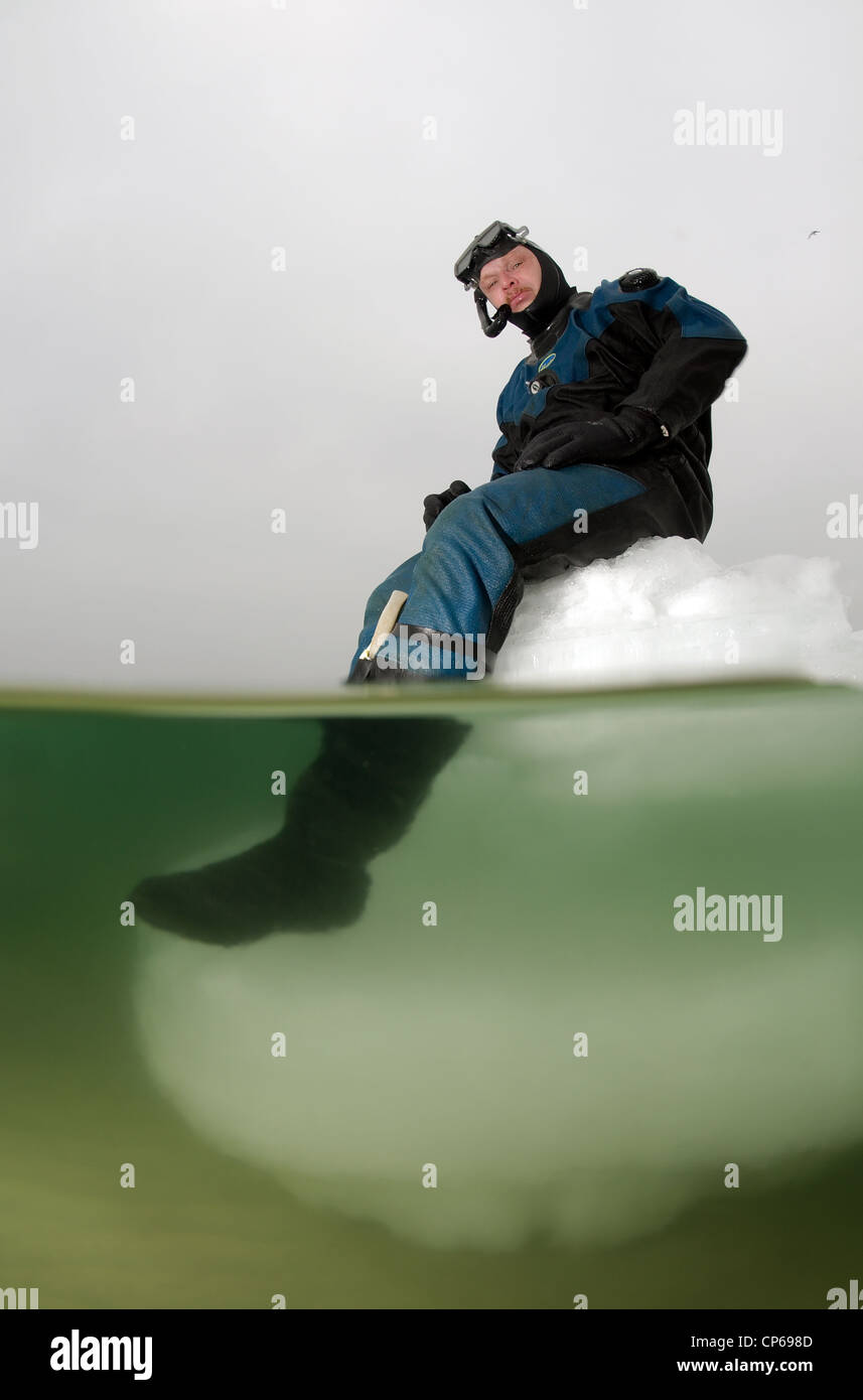 Diver, subglacial diving, ice diving, in the frozen Black Sea, a rare