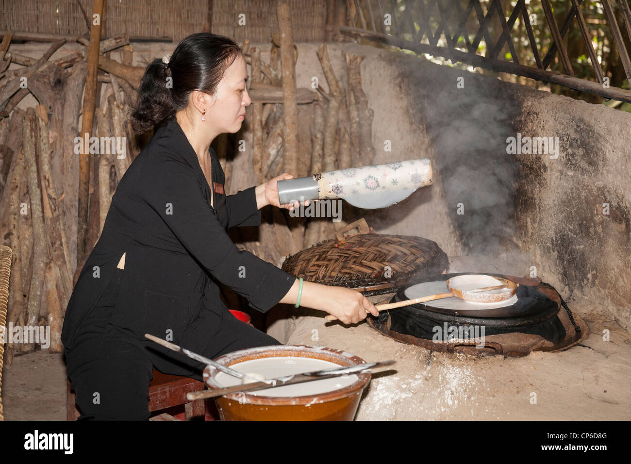 Vietnamese woman making rice paper, Ben Dinh, Cu Chi, near Ho Chi Minh