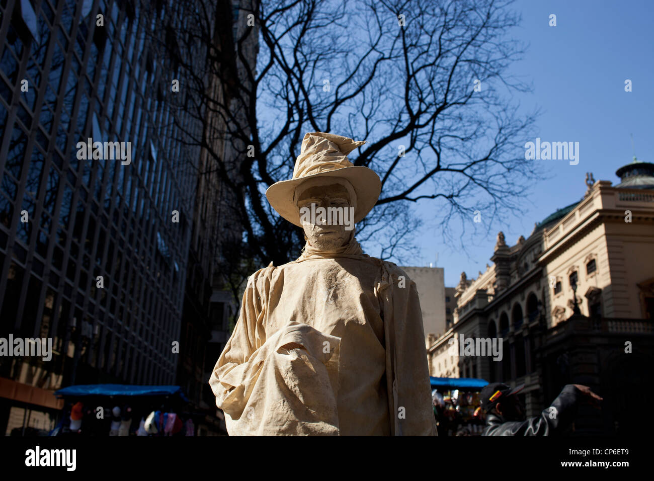 Living statue downtown Sao Paulo Brazil Mime artist posing for hours in street like a statue with realistic statue-like makeup Stock Photo