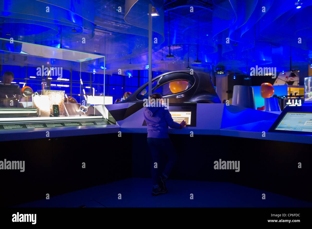Young girl looking at an interactive exhibit in the Science Museum, London. Stock Photo