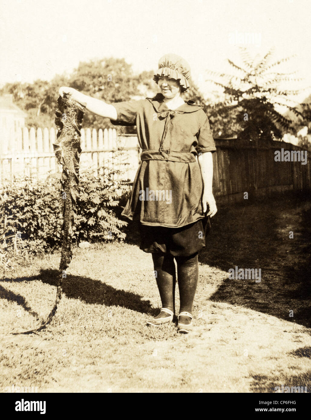 Ugly Woman Displaying Snake Skin Stock Photo