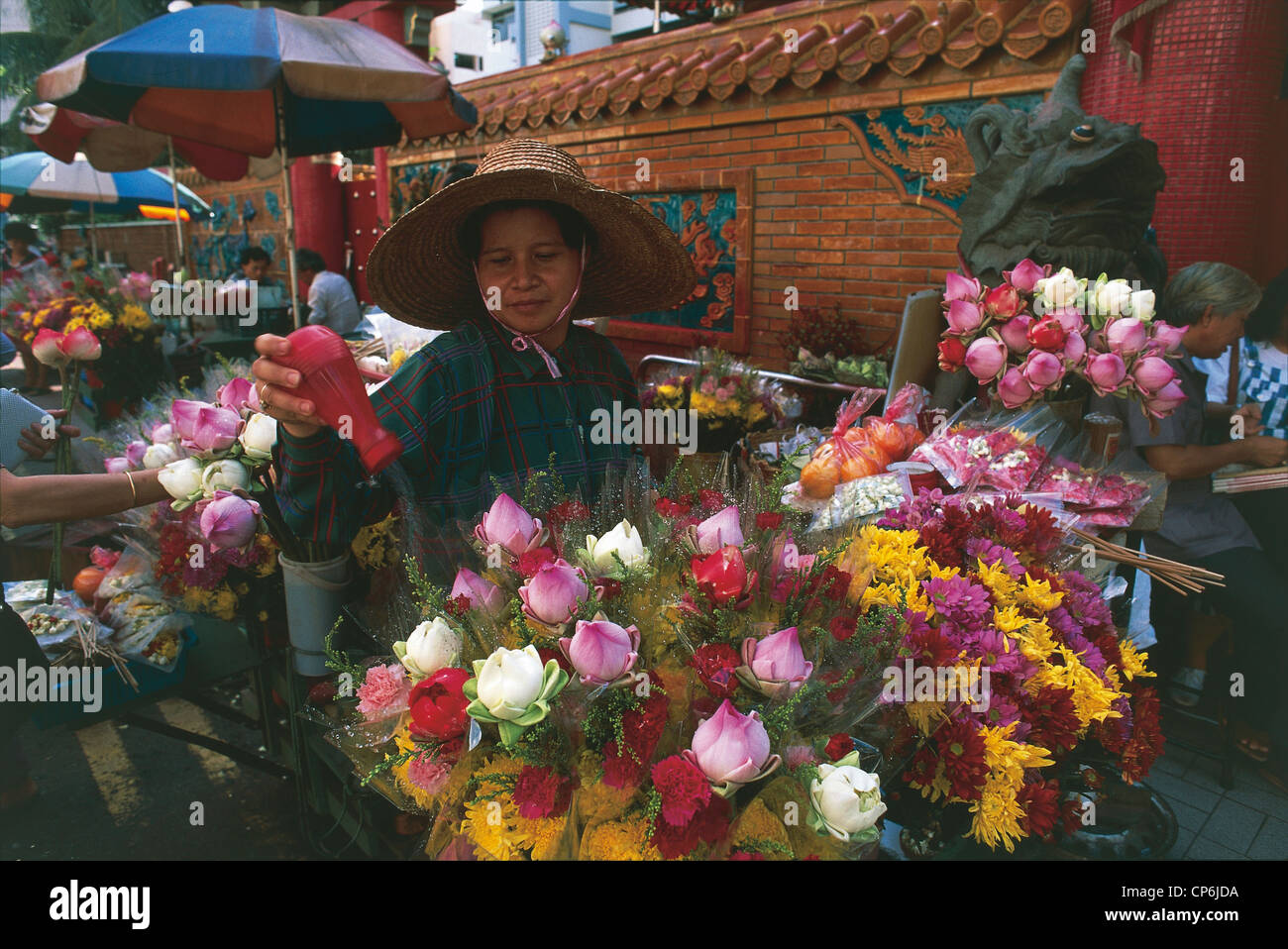 Republic of Singapore - Singapore. The stand of a woman selling lotus flowers Stock Photo