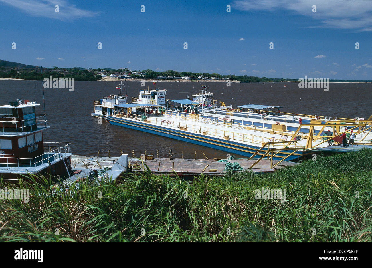 Venezuela - Guayana - Amazonas - Puerto Ayacucho. A boat docked at a pier on the Orinoco River Stock Photo