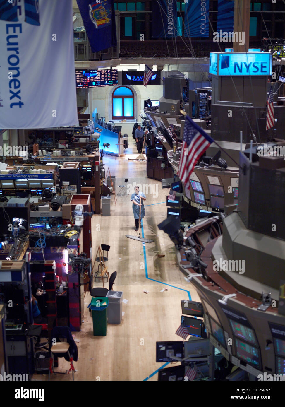 Workers clean the floor of the New York Stock Exchange Stock Photo