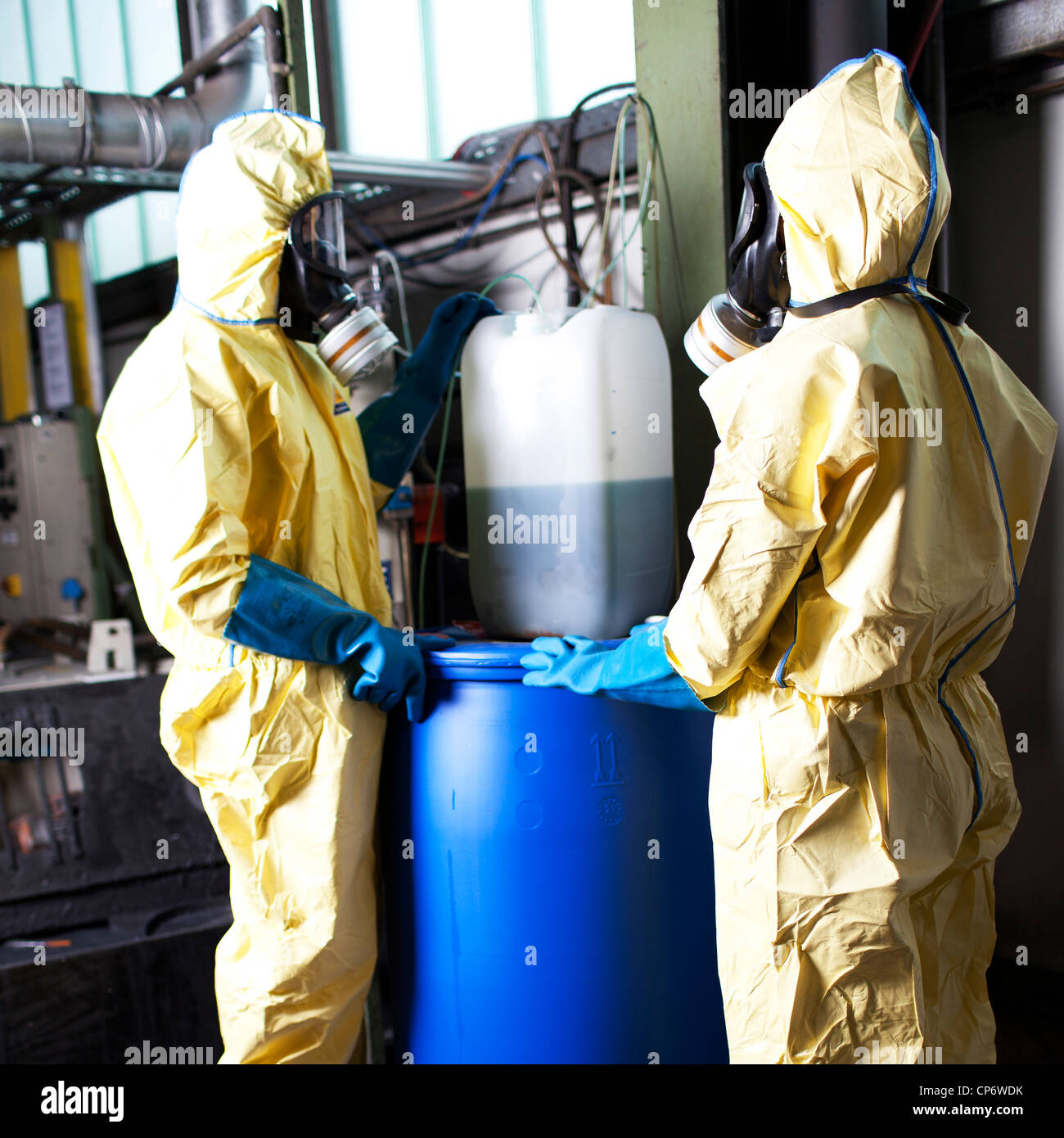 Experts disposing infested material Stock Photo