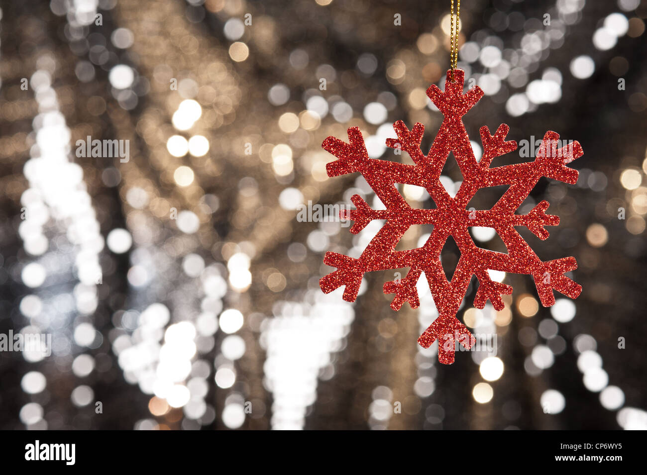 Red snow flake on a gold glitter background for Christmas Stock Photo ...