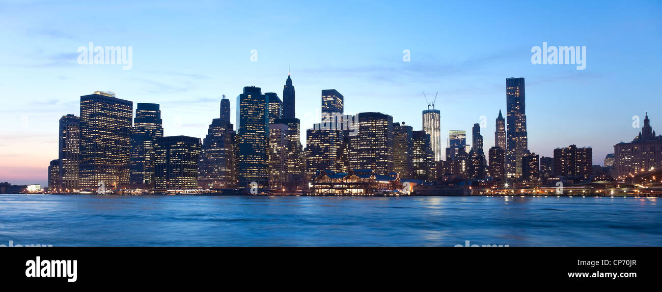 The New York City skyline at twilight w the Freedom tower Stock Photo ...