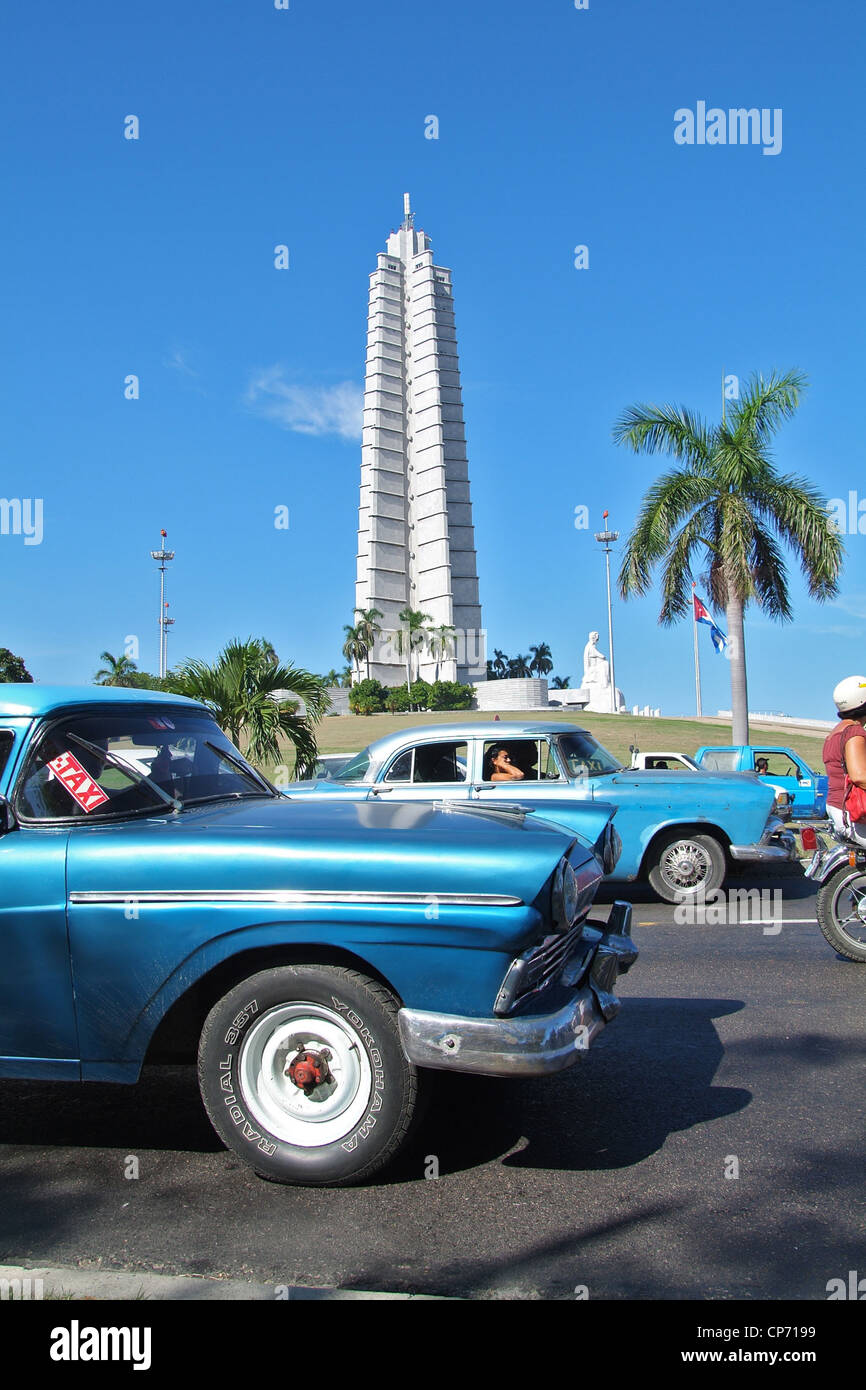Vintage cars passing the obelisk on the Plaza de la Revolucion, Havana, Cuba Stock Photo