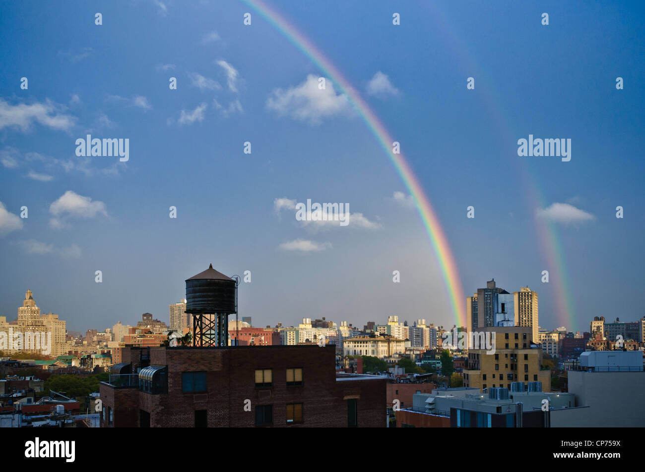 A double rainbow, as seen from the roof of a building in West Village, New York City, NY, USA. Oct. 27, 2010. Stock Photo