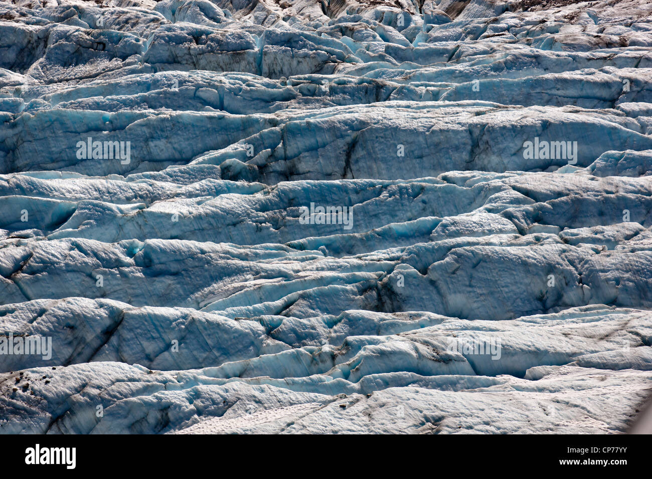 Aerial view of an unnamed glacier showing crevase details, Coastal Mountain Range north of Skagway, Southeast Alaska, Summer Stock Photo