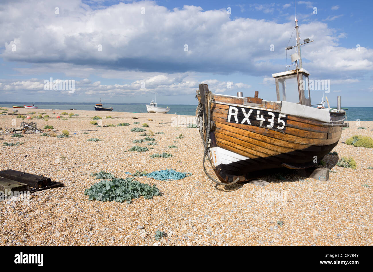 Fishing boats on shingle beach Dungeness Kent Stock Photo - Alamy
