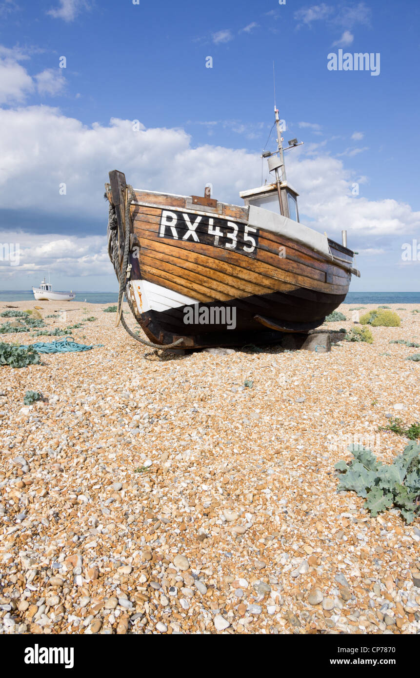 Fishing boat on shingle beach Dungeness Kent Stock Photo - Alamy