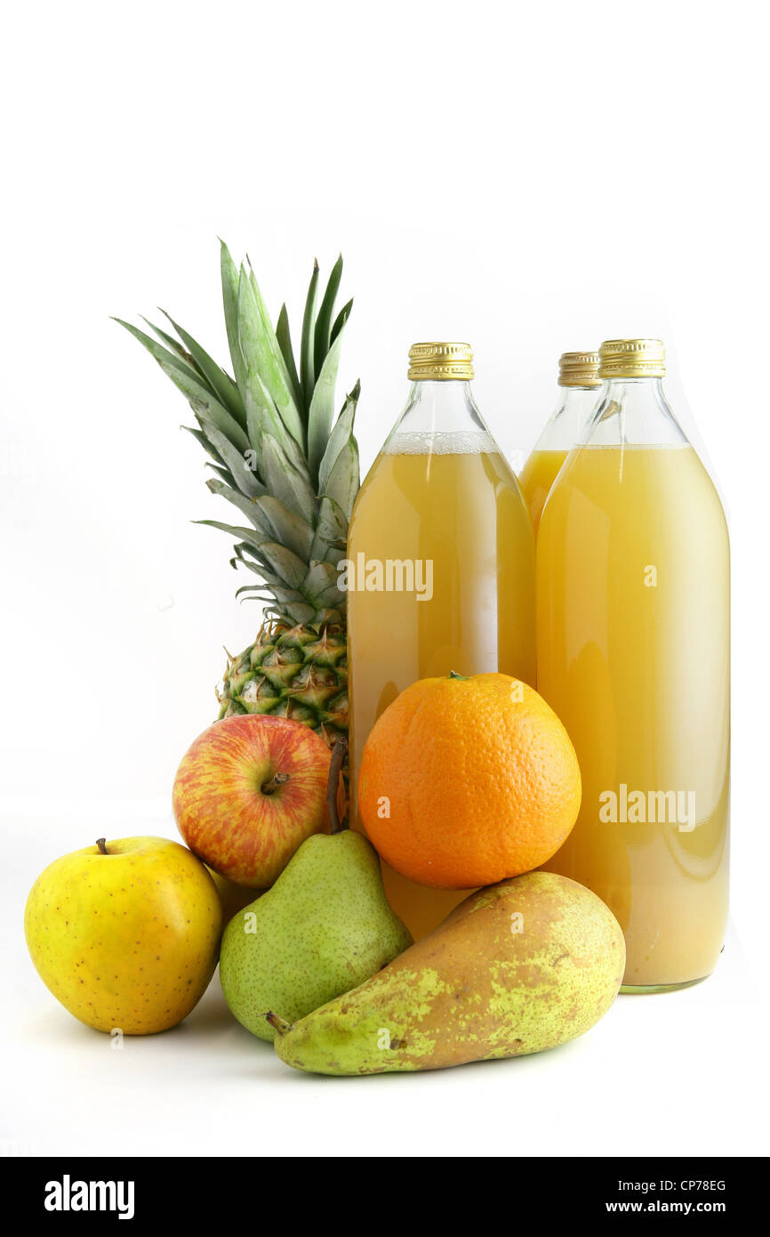 Various fruits by glass juice bottles Stock Photo Alamy