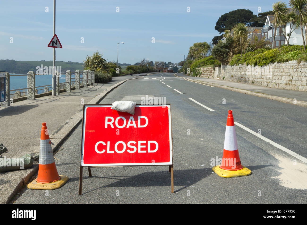 Red British road closed sign on Cliff Road in Falmouth, Cornwall UK. Stock Photo
