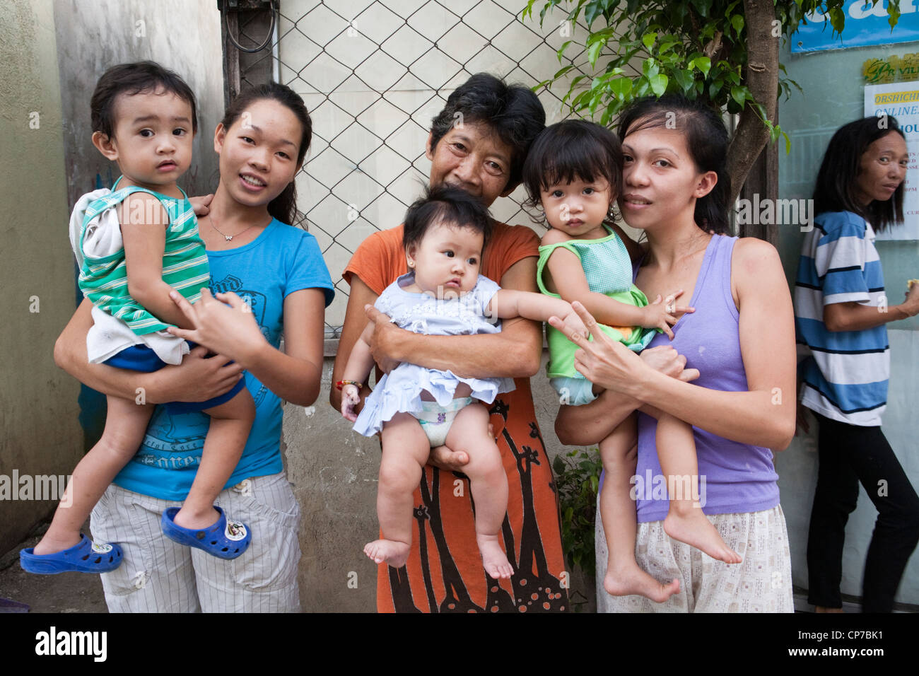 A three generation Filipino family. Lapu-Lapu City, Metro Cebu, Mactan Island, Visayas, Philippines. Stock Photo