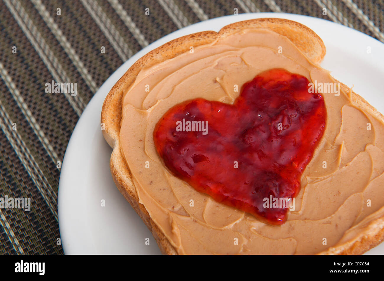 Peanut butter and jelly on toast served for valentines day Stock Photo Alamy