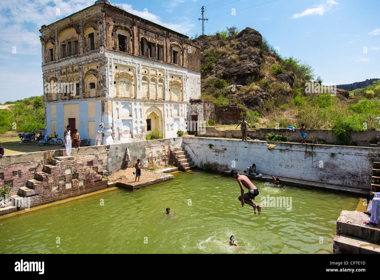Boys swimming in the tank of a Haveli outside Rhotas Fort in Punjab Province, Pakistan Stock Photo