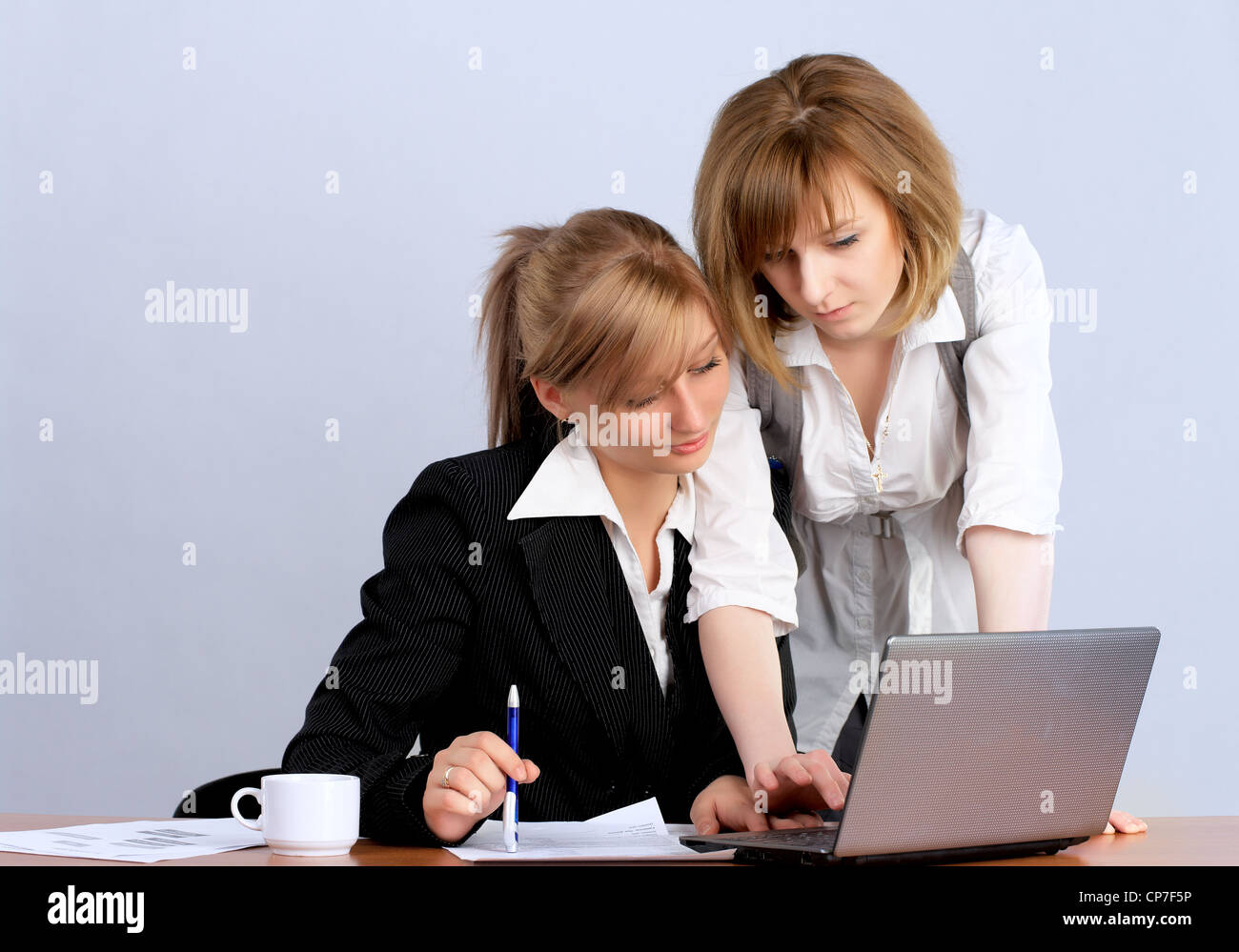 Two businesswoman working together in the office Stock Photo - Alamy