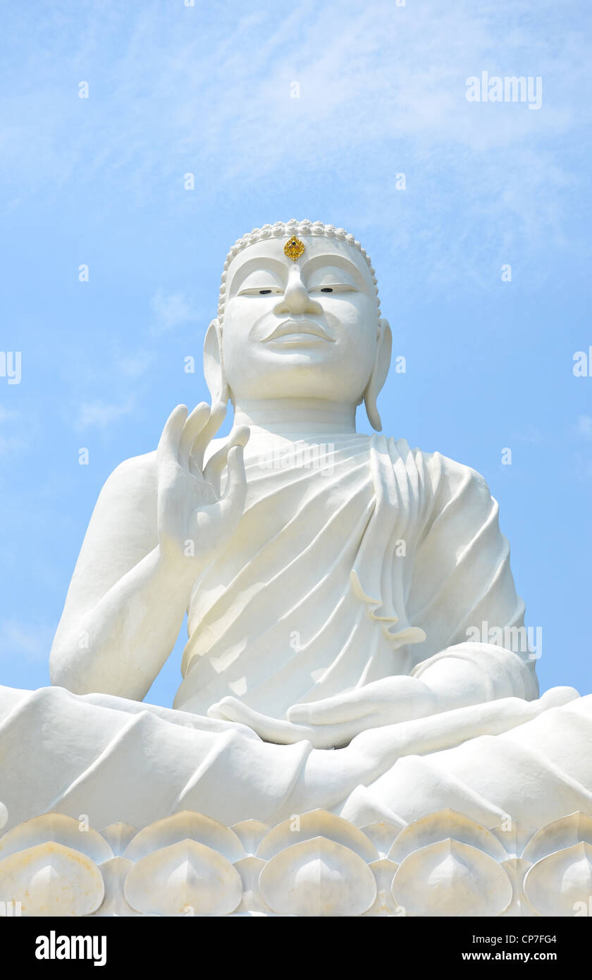 white buddha image with blue sky , northeast of Thailand Stock Photo