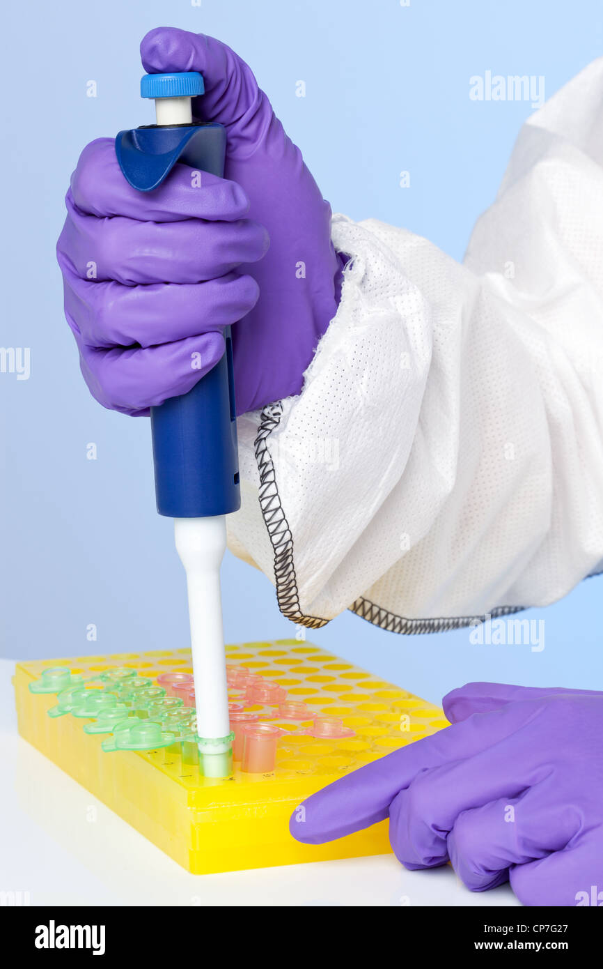 Photo of a lab technicians hands using a pipette Stock Photo