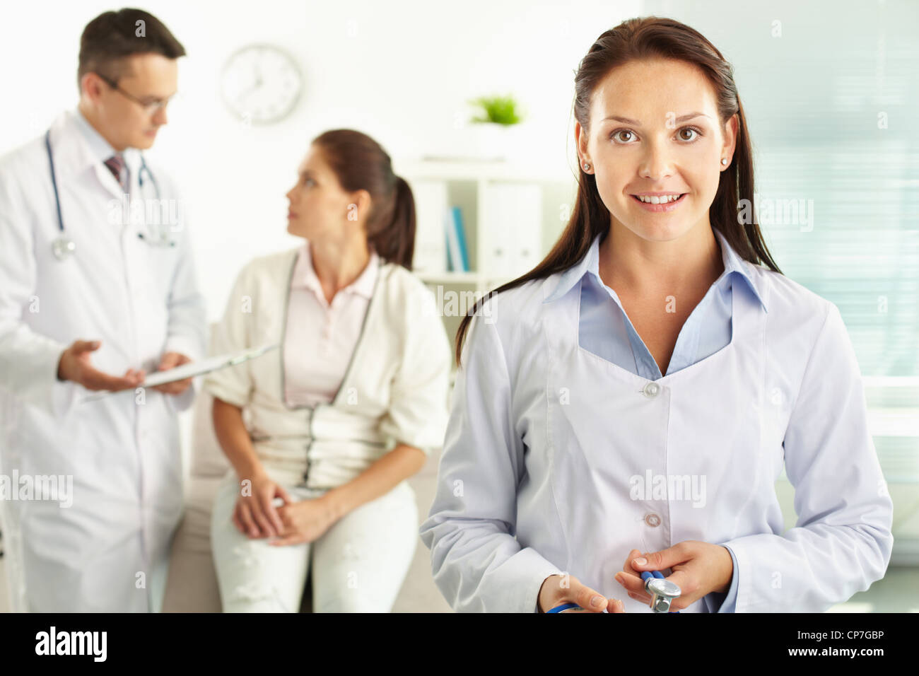 Portrait female doctor talking camera hi-res stock photography and ...