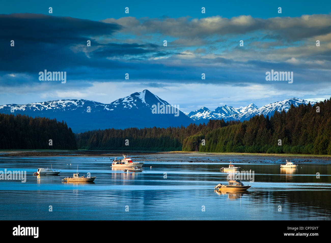 Scenic evening view of Bartlett Cove and moored fishing boats, Glacier Bay National Park & Preserve, Southeast Alaska, Summer Stock Photo
