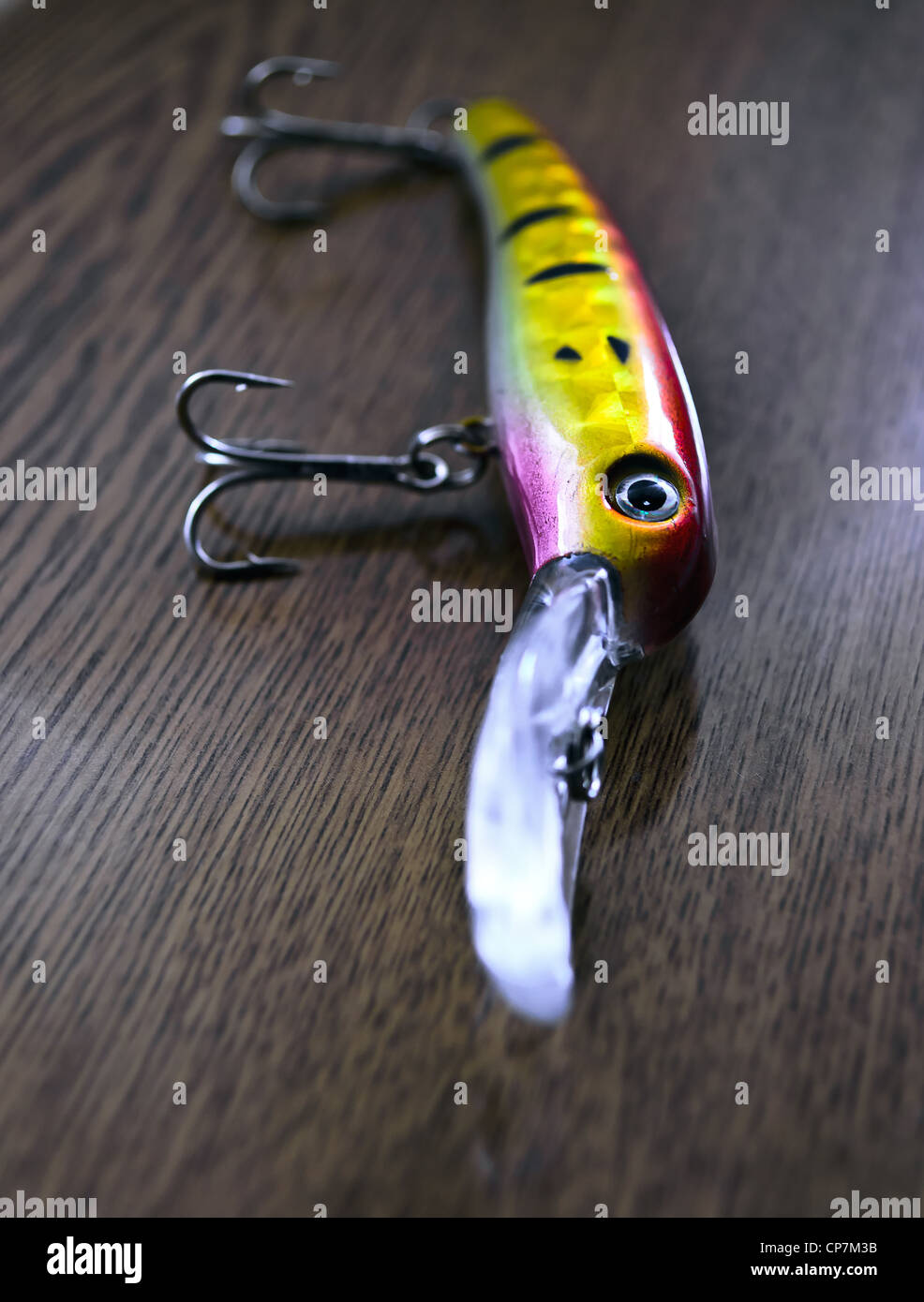 Fishing lure - Wobbler on wooden background Stock Photo