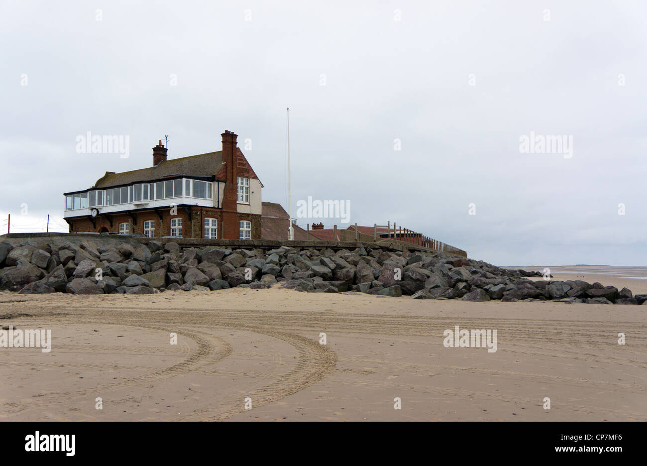 Rock armour (rip rap), protecting Royal West Norfolk Golf Club clubhouse  from coastal erosion. Brancaster Stock Photo
