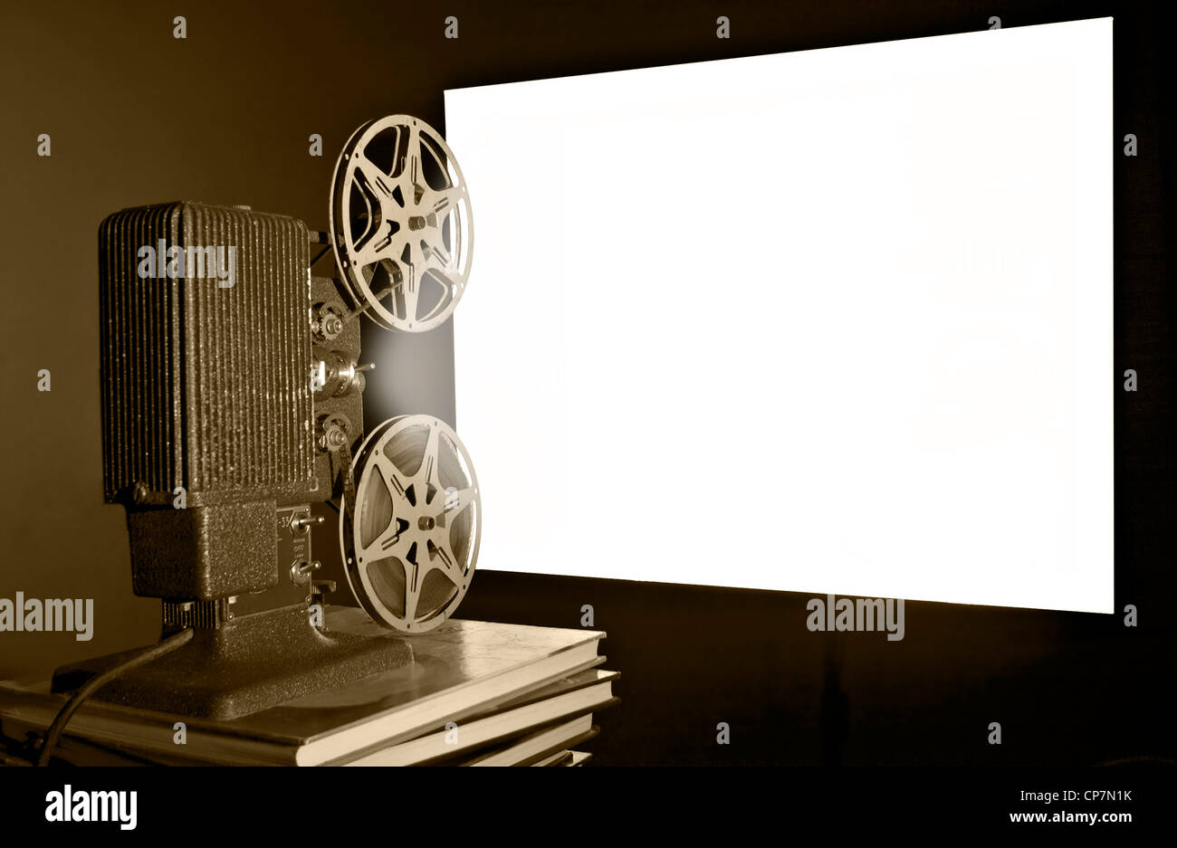 A vintage reel to reel film movie projector shot in a home setting