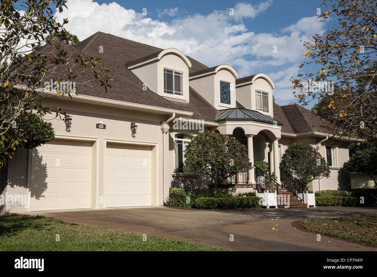 House Exterior With Two Car Garage And Dormer Windows Usa Stock